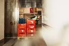 male unloading crates from truck